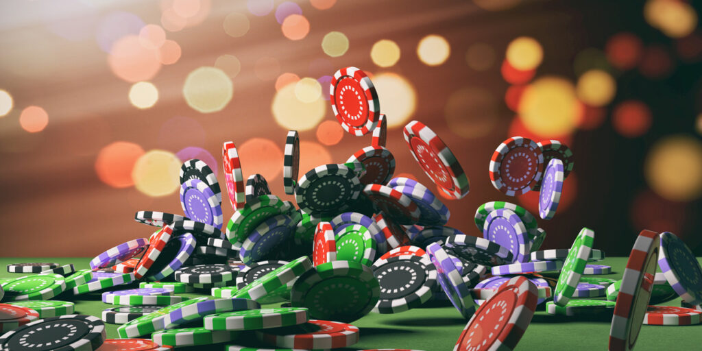 Casino poker chips falling on green felt background. 3d illustration